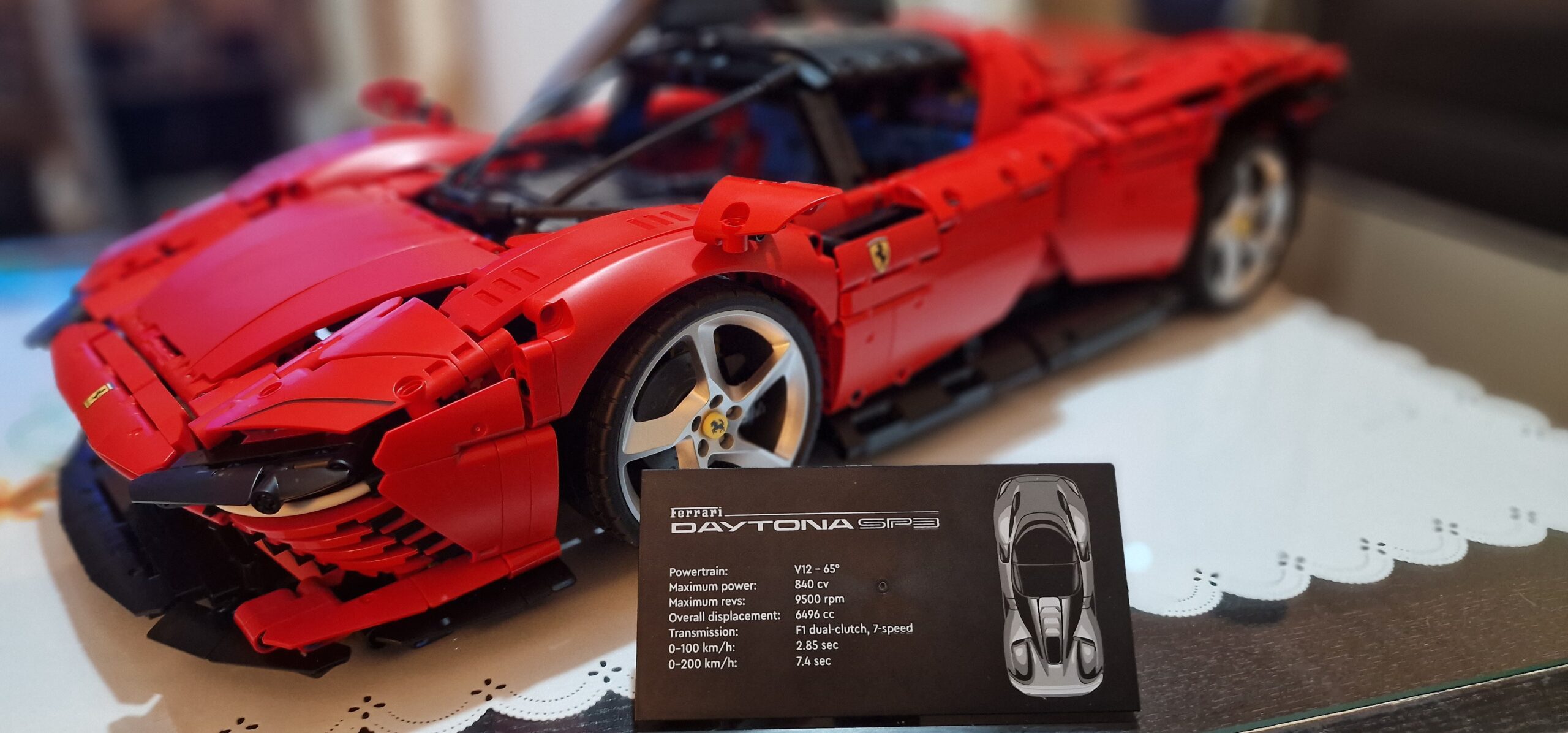 LEGO Technic Ferrari Daytona SP3 42143 front view with info card