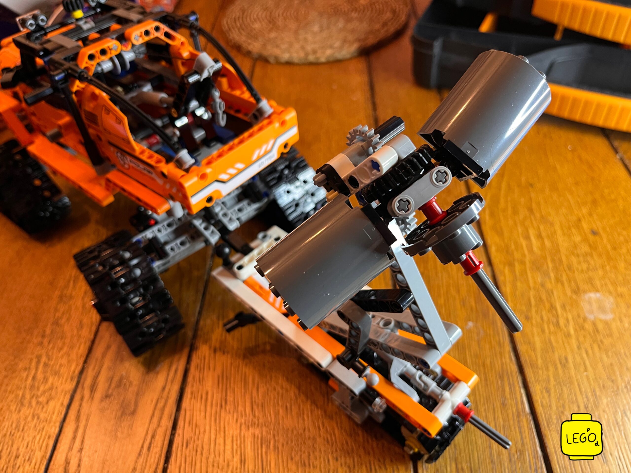 LEGO Technic 42099 4x4 X-treme Off-Roader angled view during build on wooden table