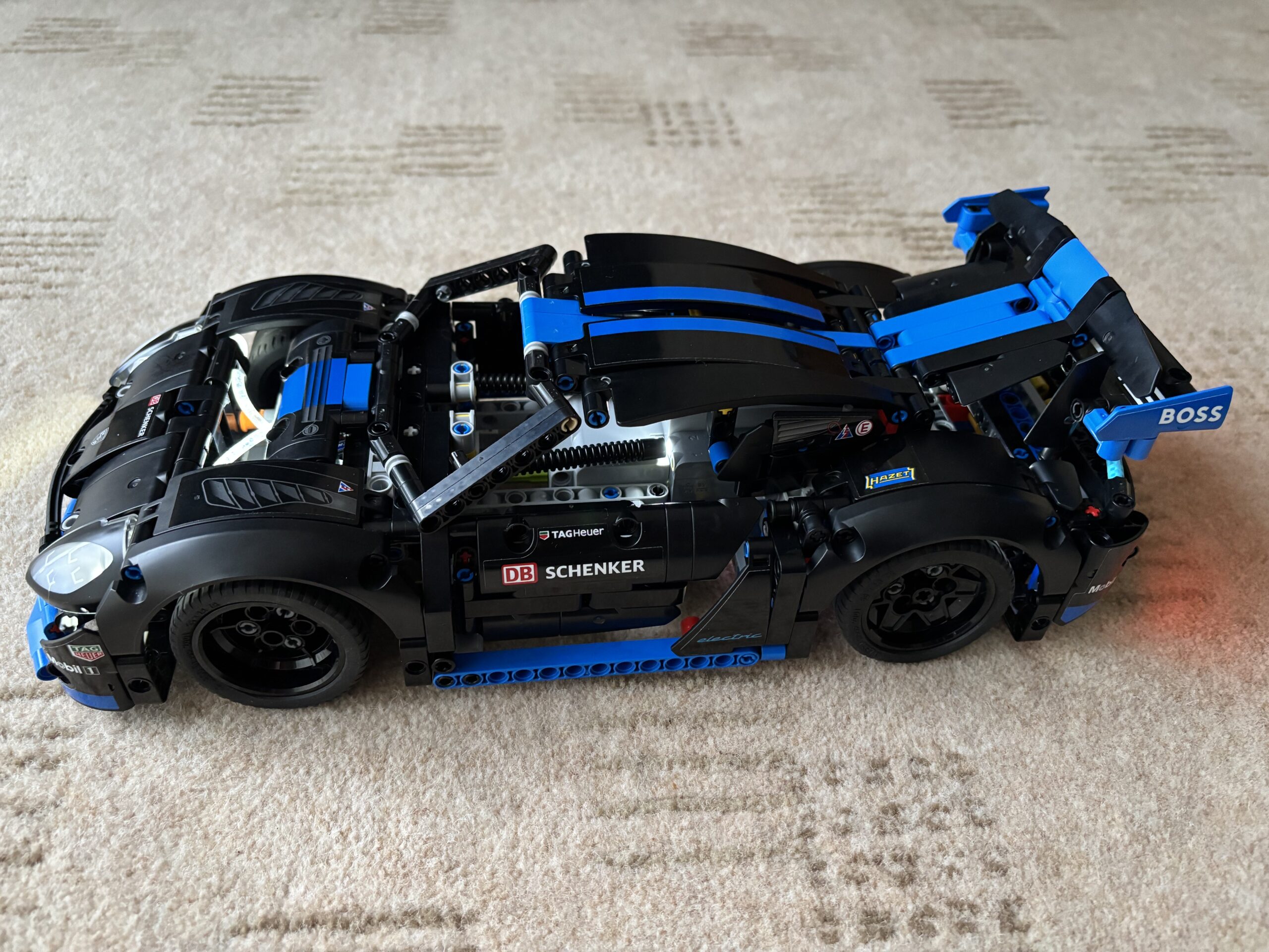 LEGO Technic Ford GT 42154 member build in progress, showing white and blue bodywork and Le Mans stripe detail