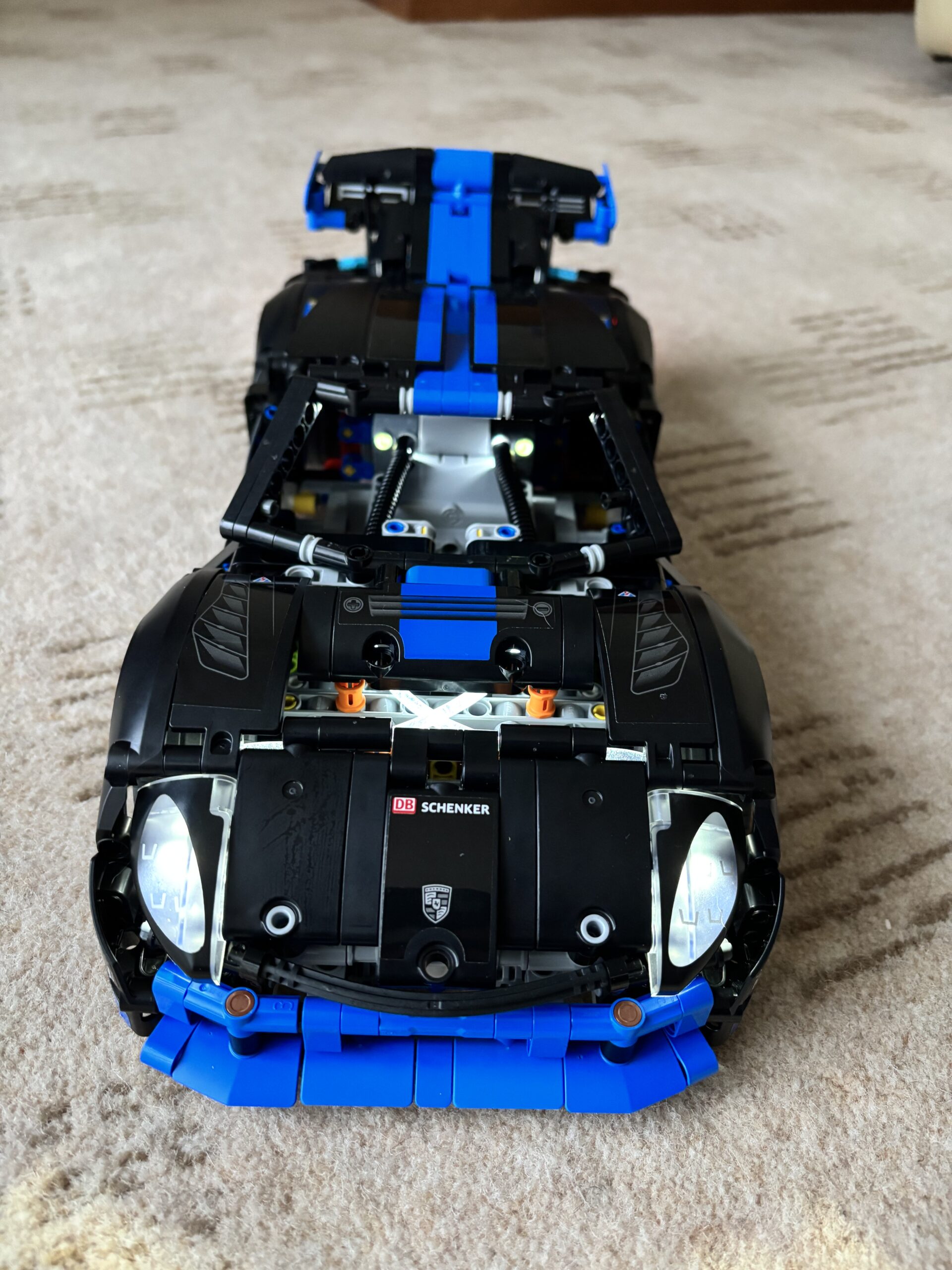 LEGO Technic Ford GT 42154 completed member build showing full white and blue Le Mans livery and butterfly doors
