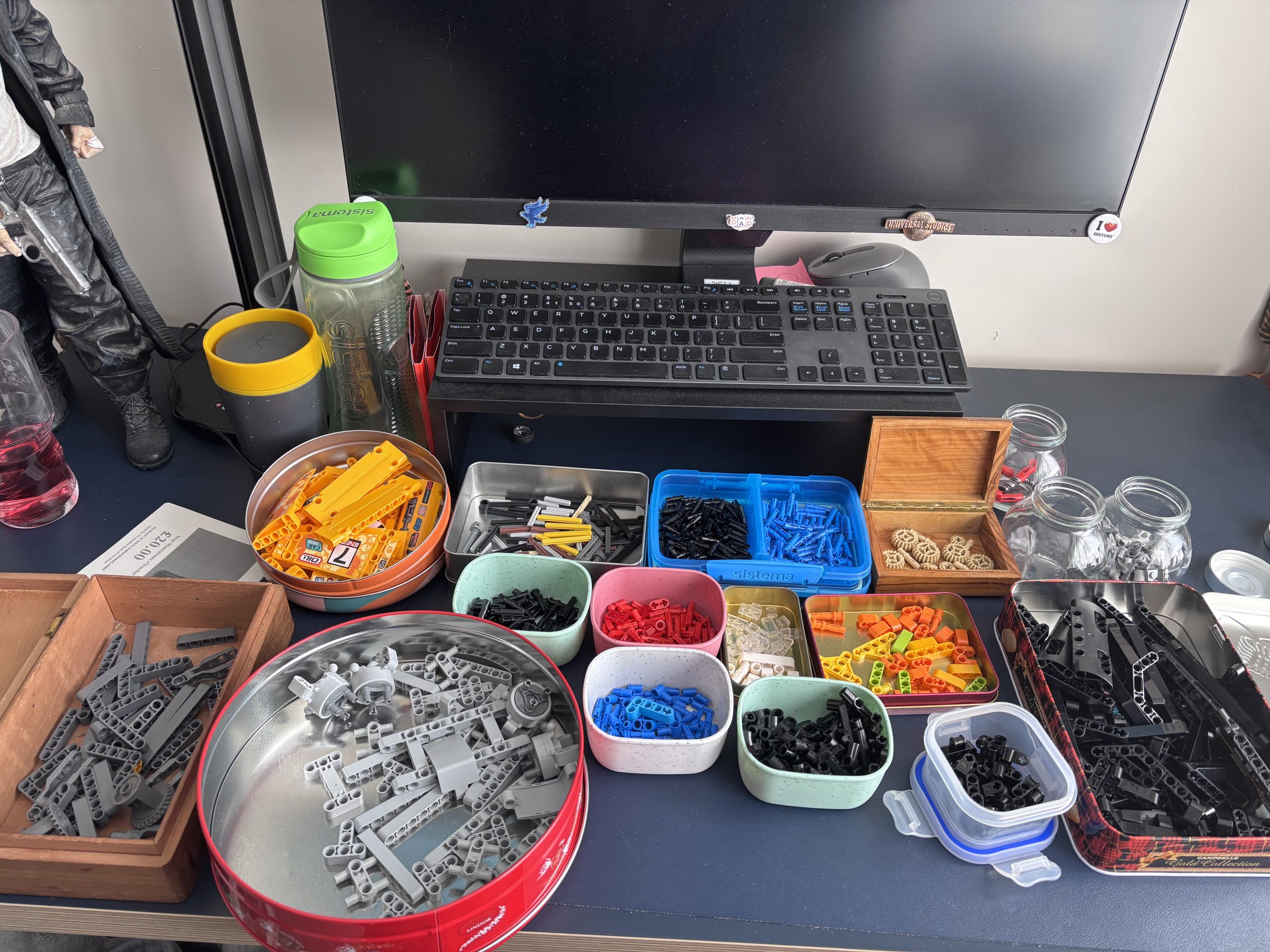 LEGO Technic 42099 parts sorted into trays on a subscriber's workbench before assembly