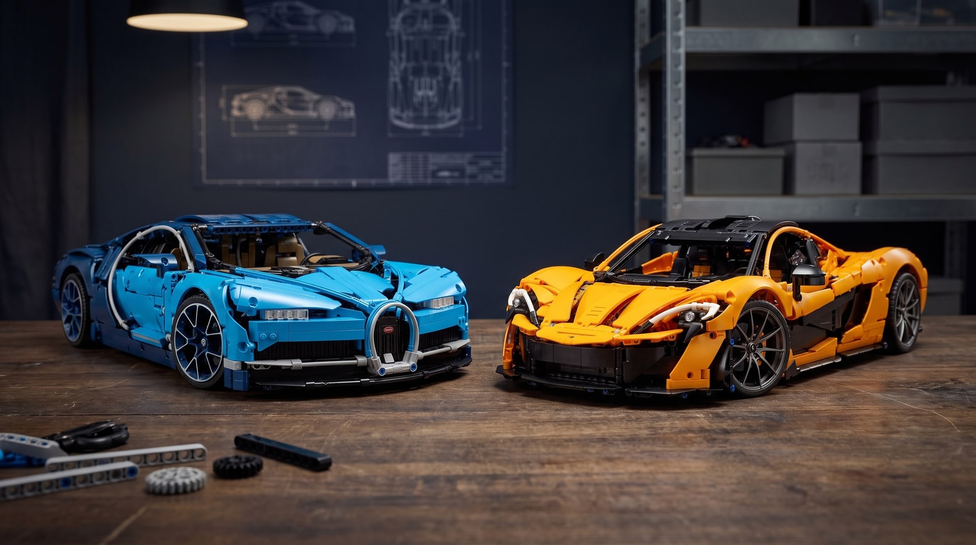 LEGO Technic Bugatti Chiron (42083) and McLaren P1 (42172) side by side on a workbench