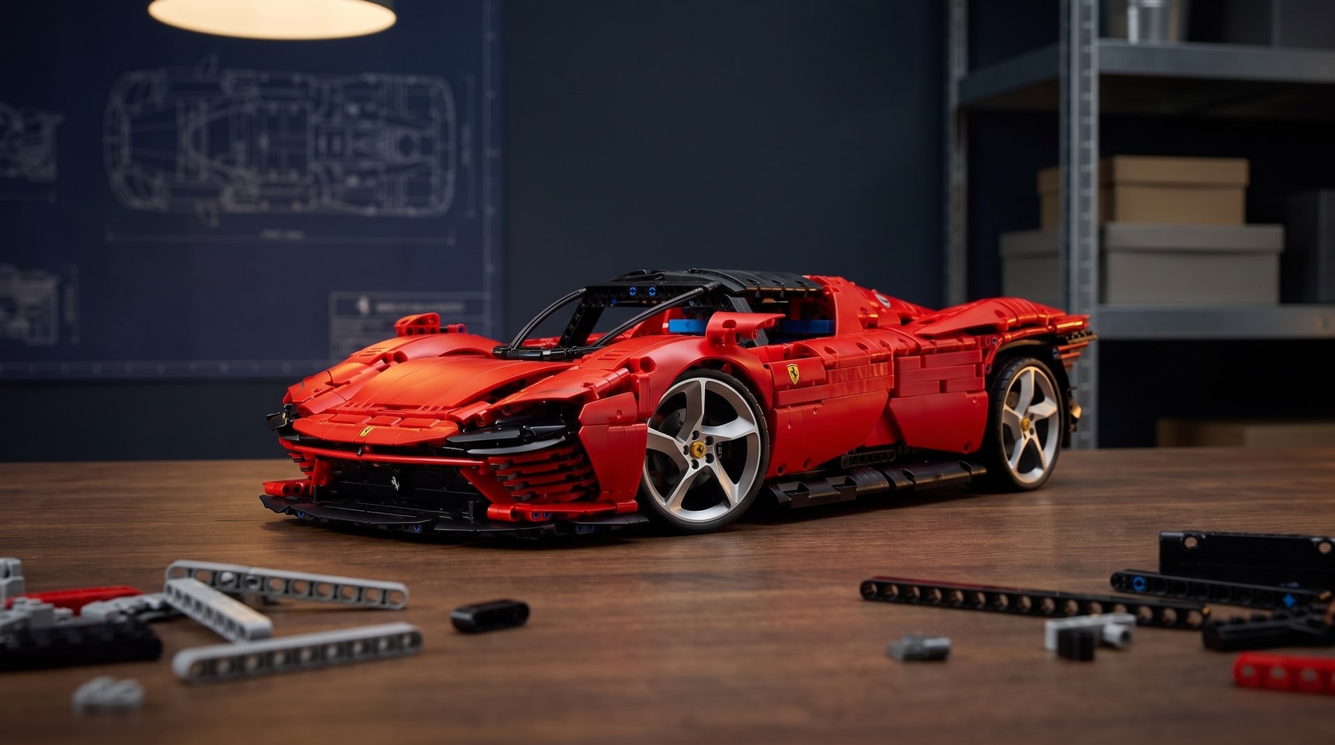 LEGO Technic Ferrari Daytona SP3 (42143) on a workbench in a home workshop