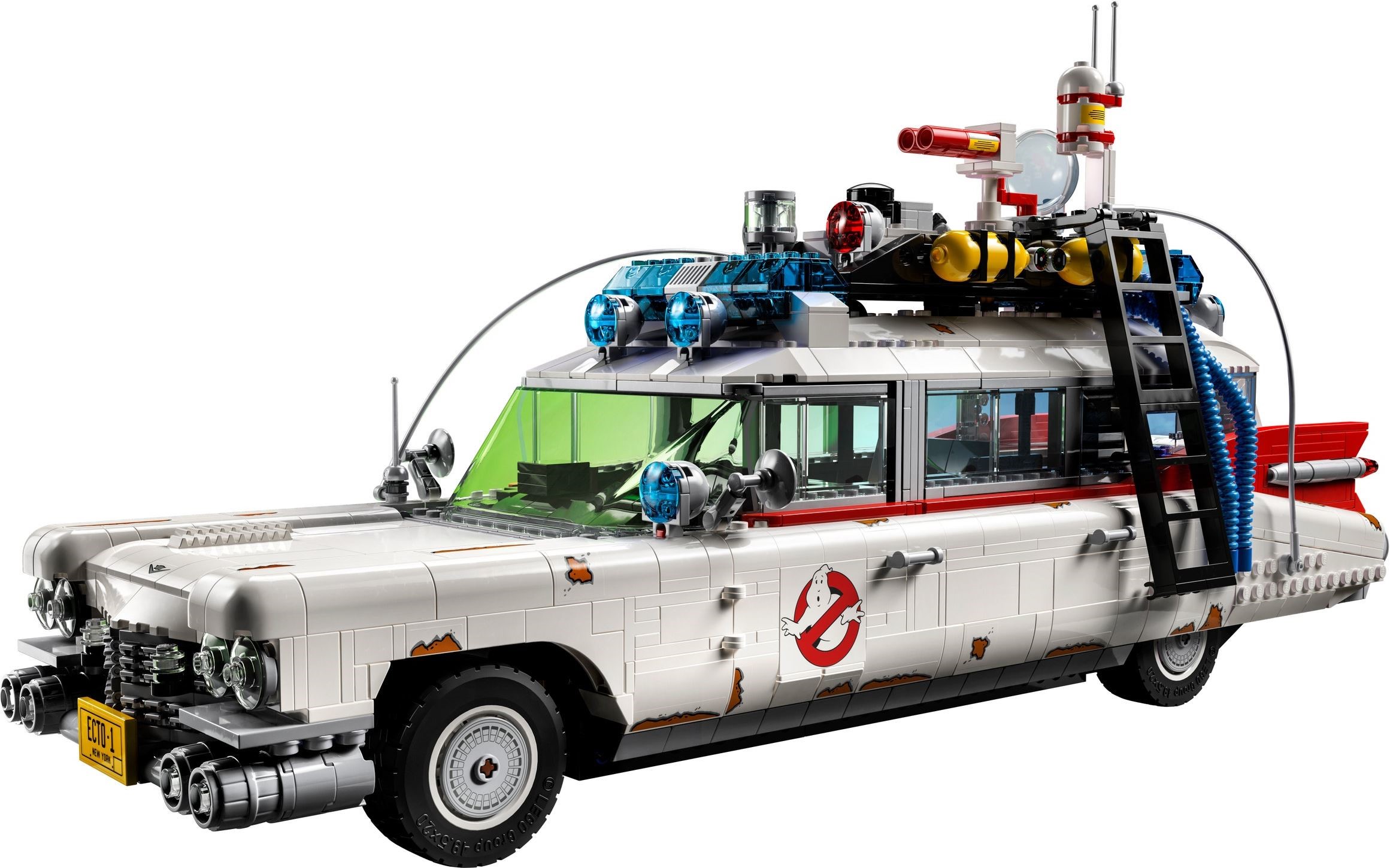 High front three-quarter view of LEGO Ghostbusters ECTO-1 (10274) showing the roof rack with blue light bar, yellow tanks, red T.U. Antenna barrels and the clear dish