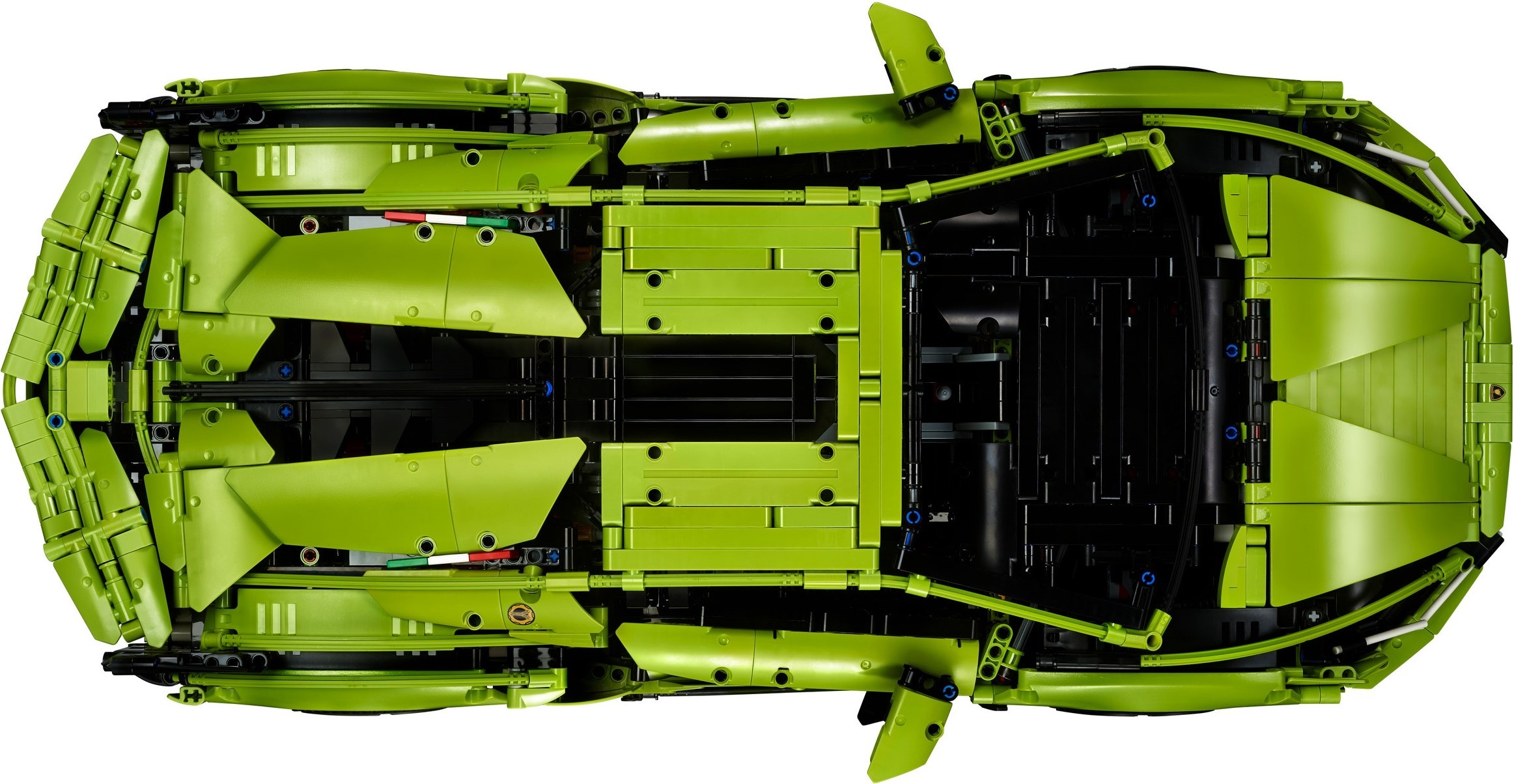 Top-down official view of LEGO Technic Lamborghini Sián FKP 37 (42115) showing the lime green engine cover with black louvres, the Italian flag tiles along its edges, the open black roof frame and the rear wing