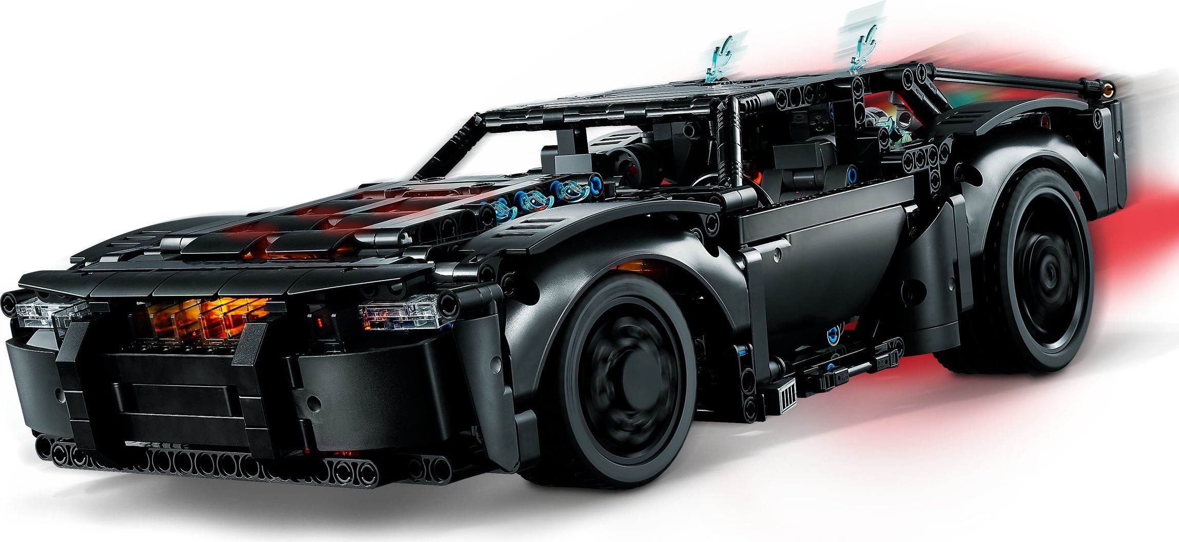 Front three-quarter view of LEGO Technic THE BATMAN Batmobile (42127) with both light bricks on: orange glow through the bonnet gaps and front grille, red glow at the rear